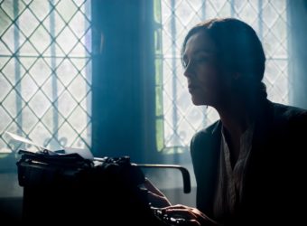 Woman writing on a typewriter